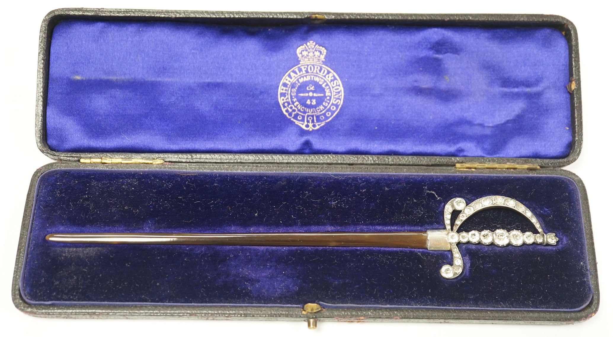 An early 20th century white metal and paste mounted tortoiseshell model of a court sword, 17.7cm, in fitted case.